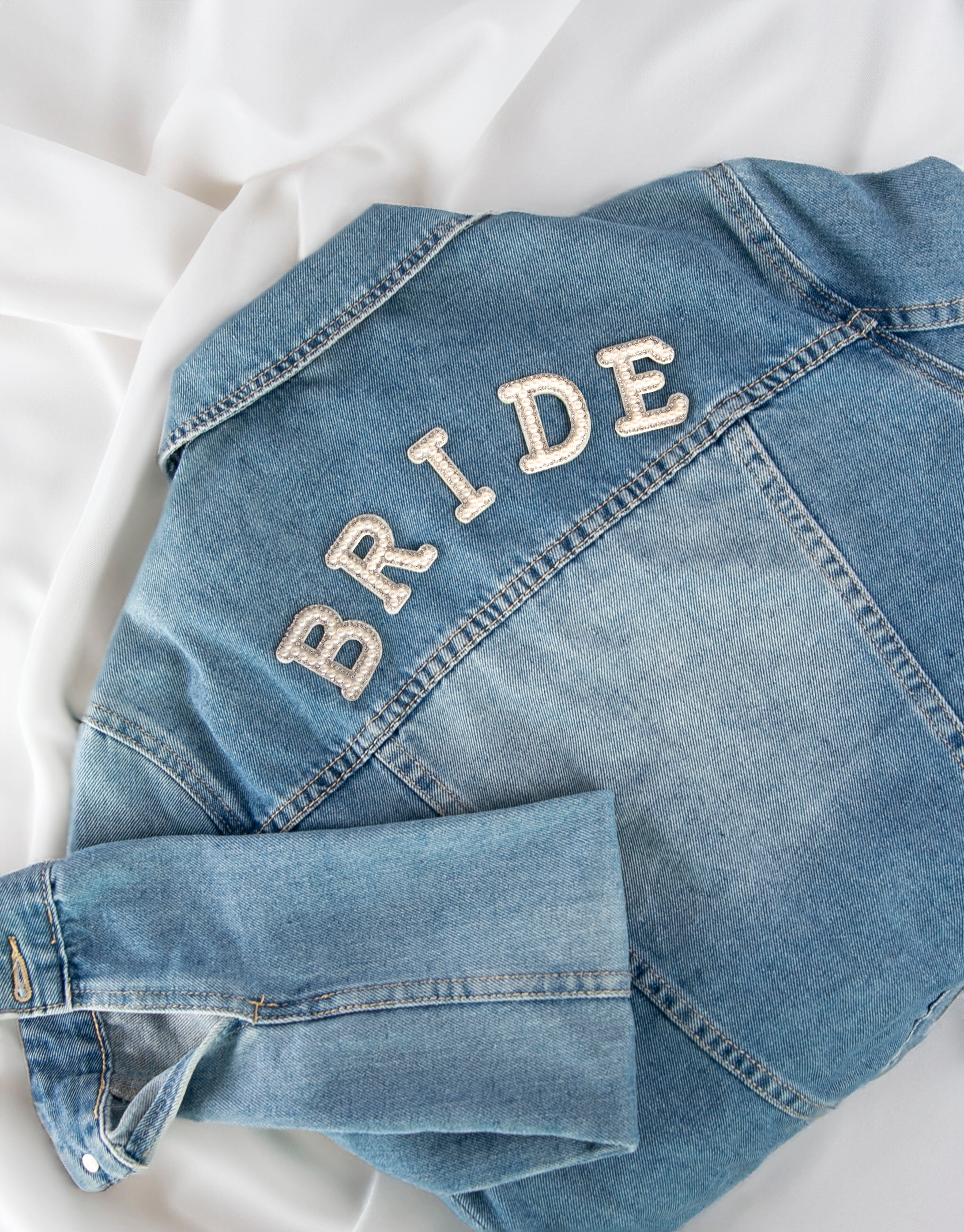 BRIDE iron-on patch on denim jacket