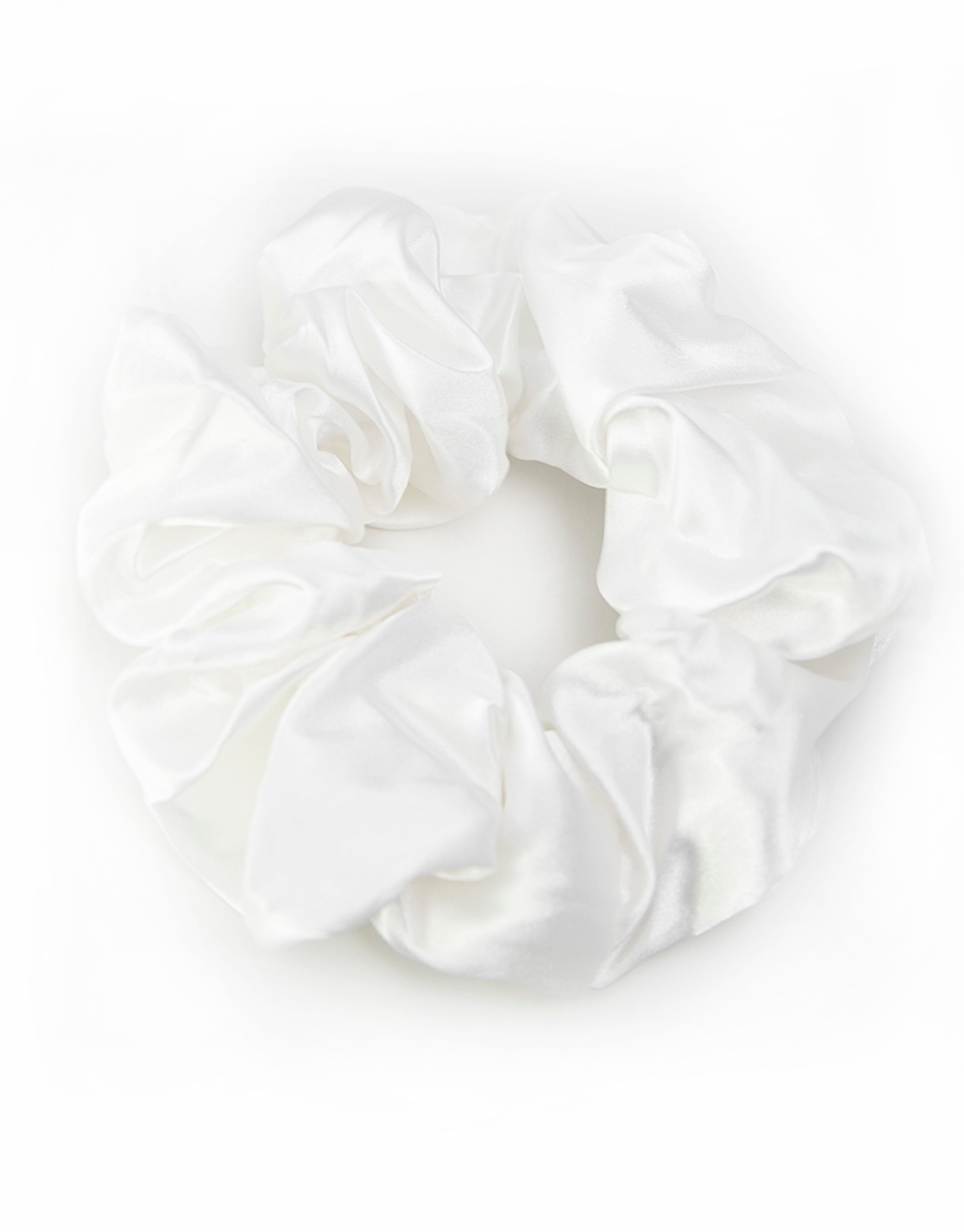 Satin scrunchies in white, soft and silky with a gentle sheen, perfect for adding a touch of elegance to hairstyles.