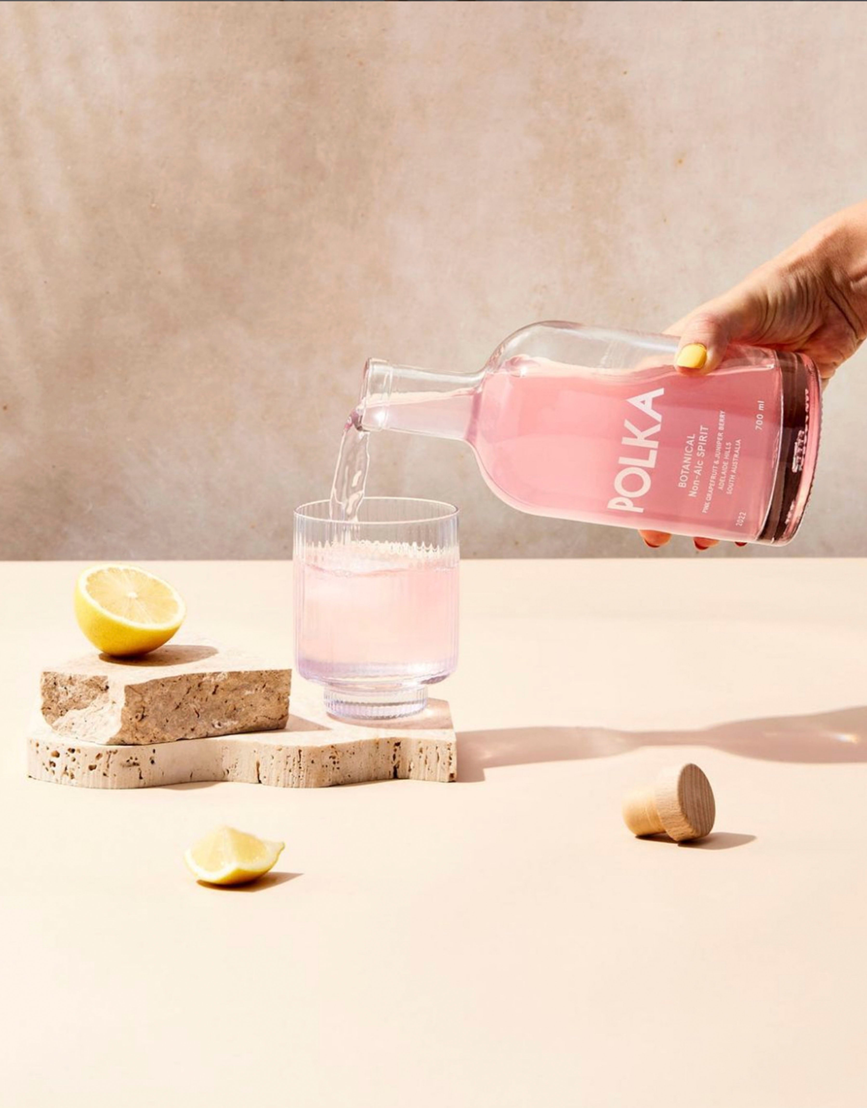 Botanical spirit being poured into a glass