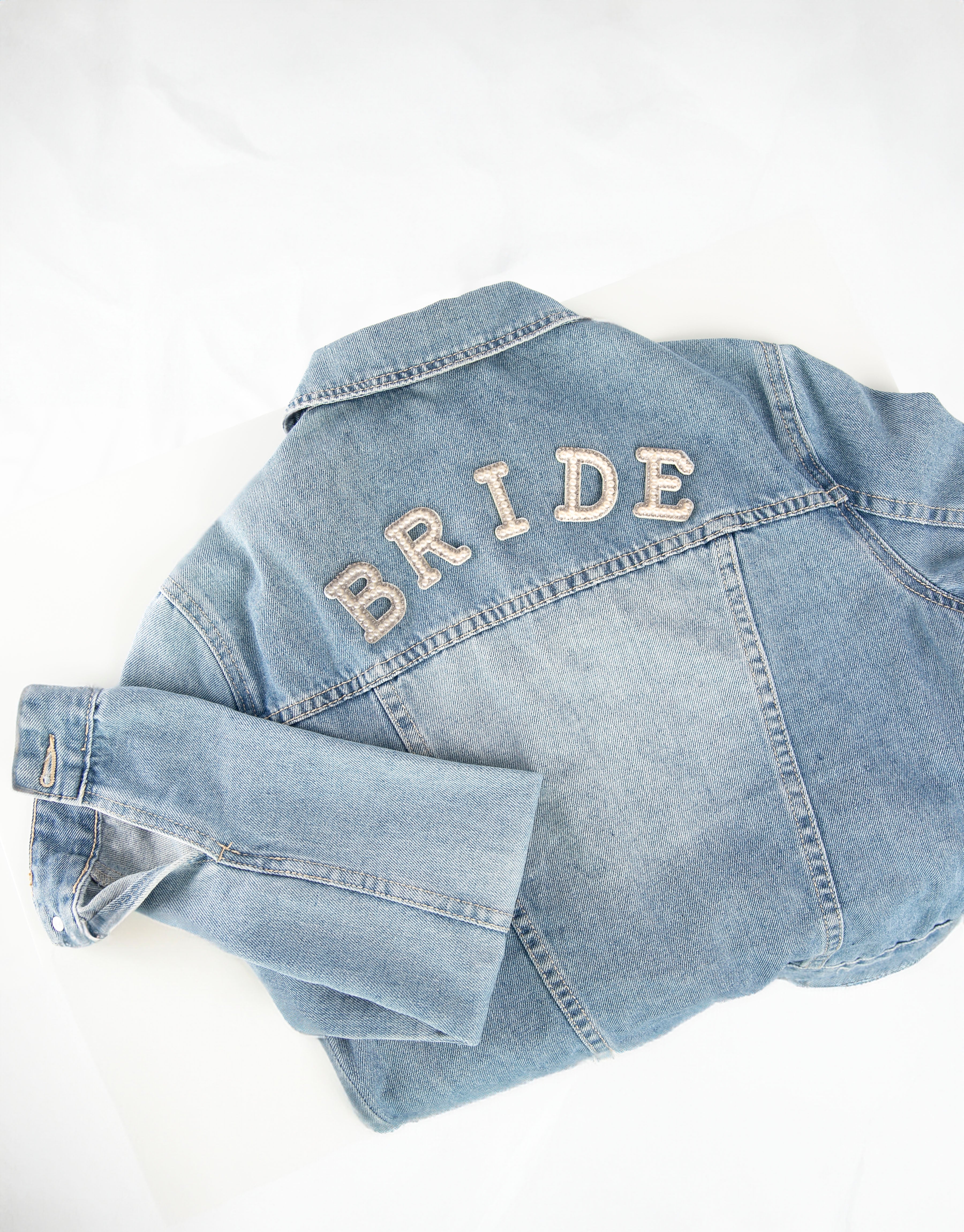 BRIDE iron-on patch on denim jacket