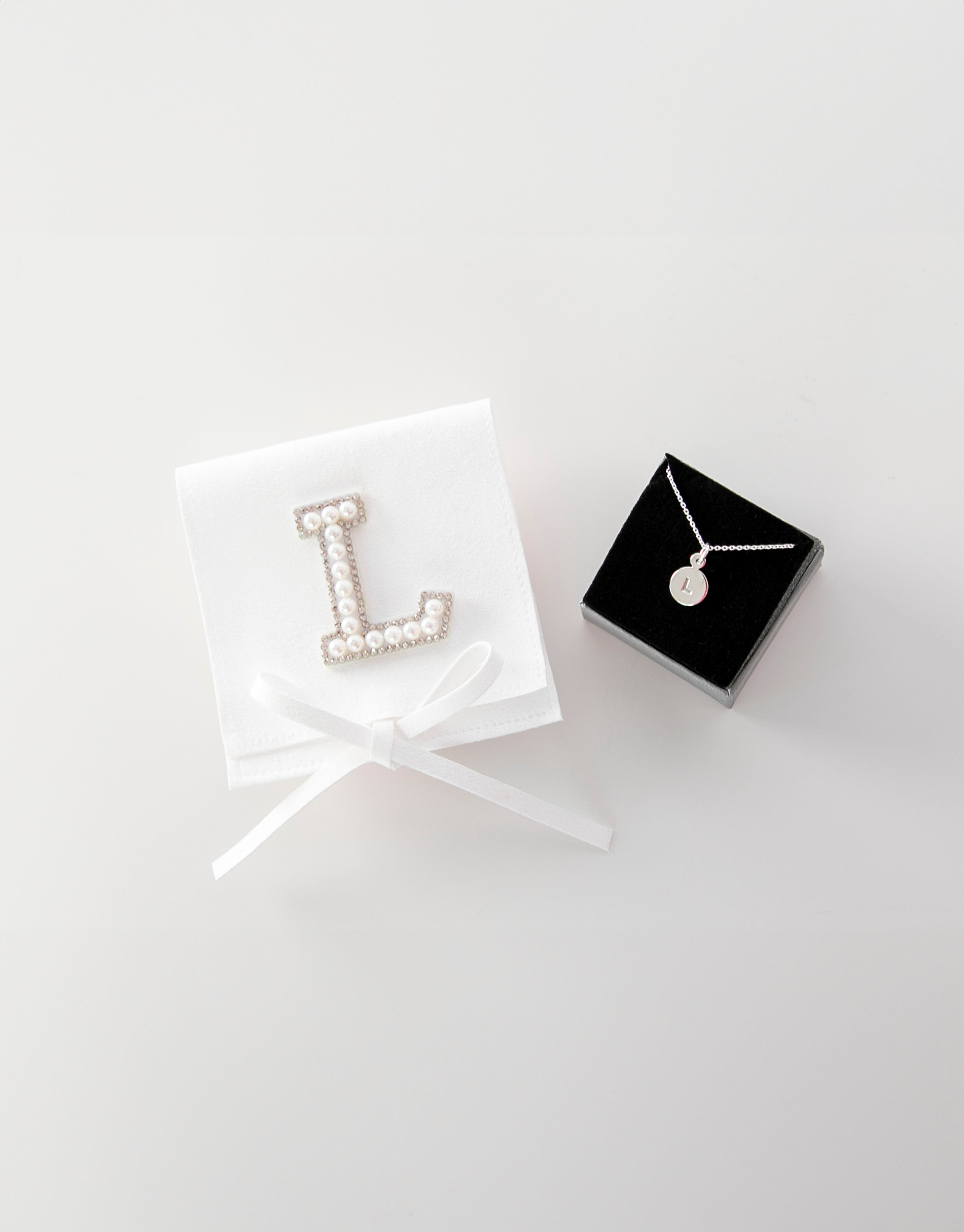 23Dreams Handmade Sueded White Pouch - Personalised with Letter "L" in white pearl and rhinestone patch next to letter necklace "L" in silver