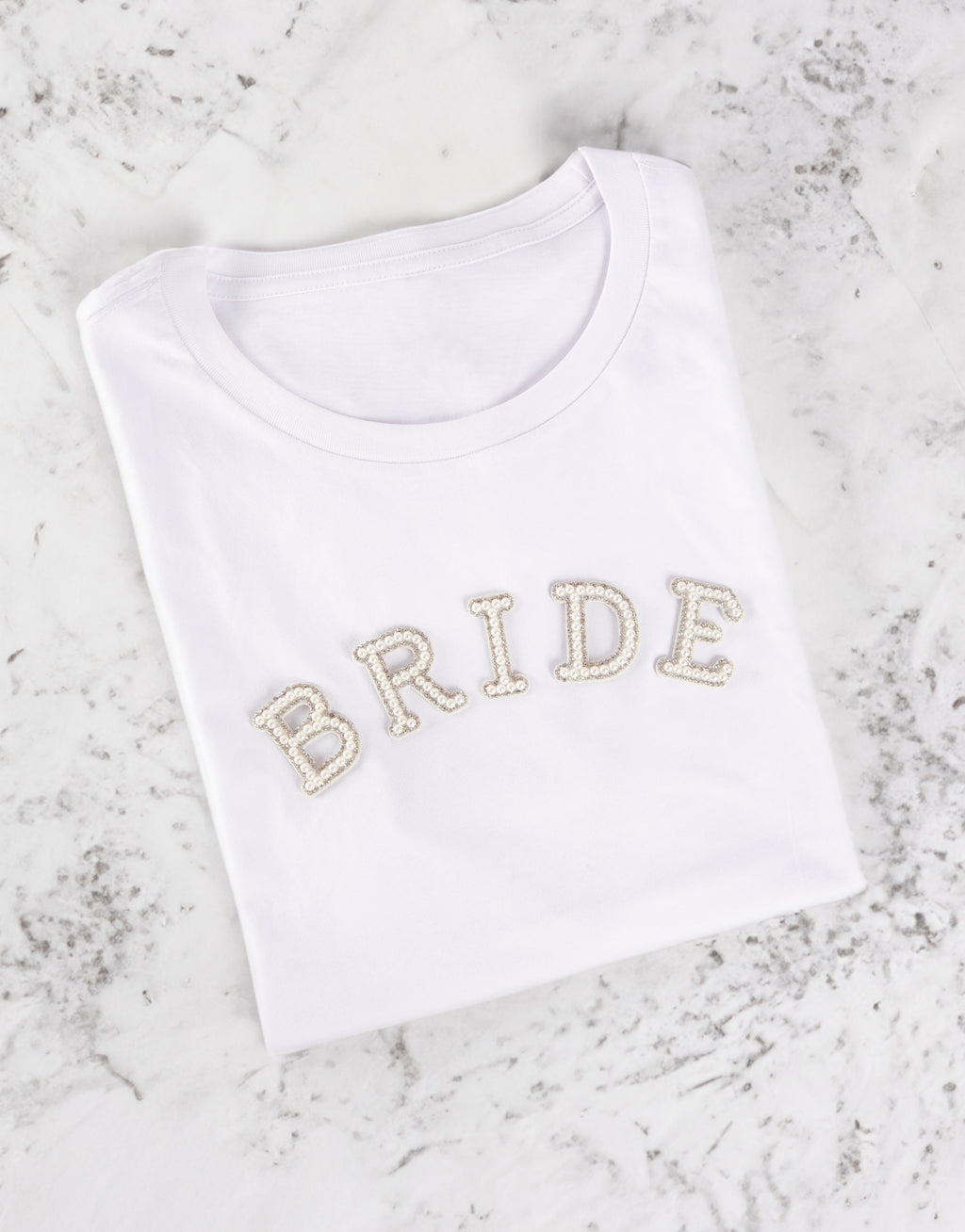 BRIDE iron-on patch on white Tshirt