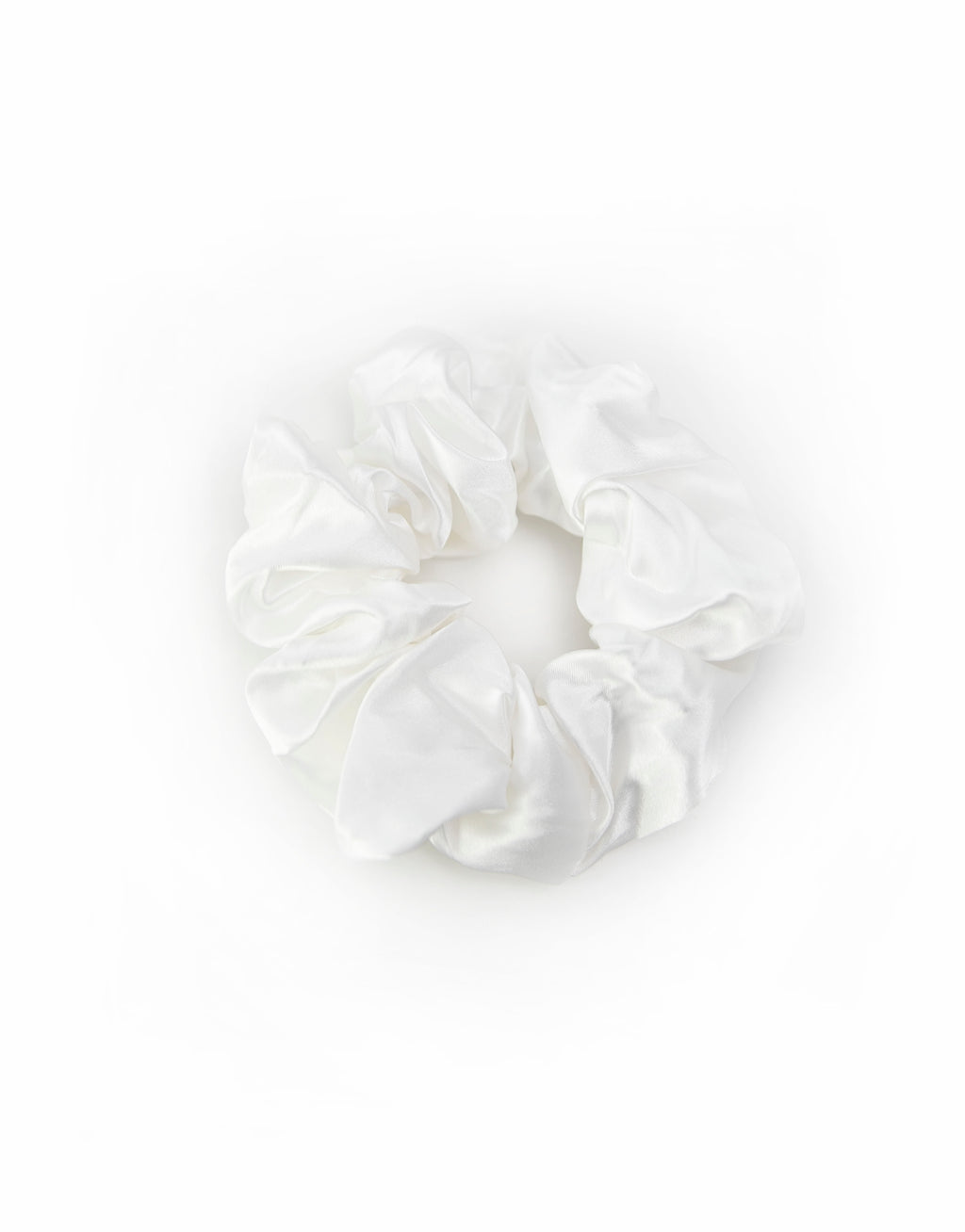 Satin scrunchies in white, soft and silky with a gentle sheen, perfect for adding a touch of elegance to hairstyles.