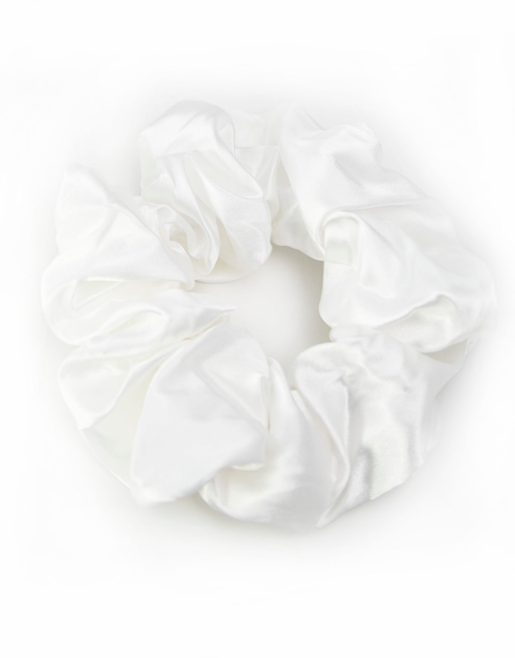 Satin scrunchies in white, soft and silky with a gentle sheen, perfect for adding a touch of elegance to hairstyles.