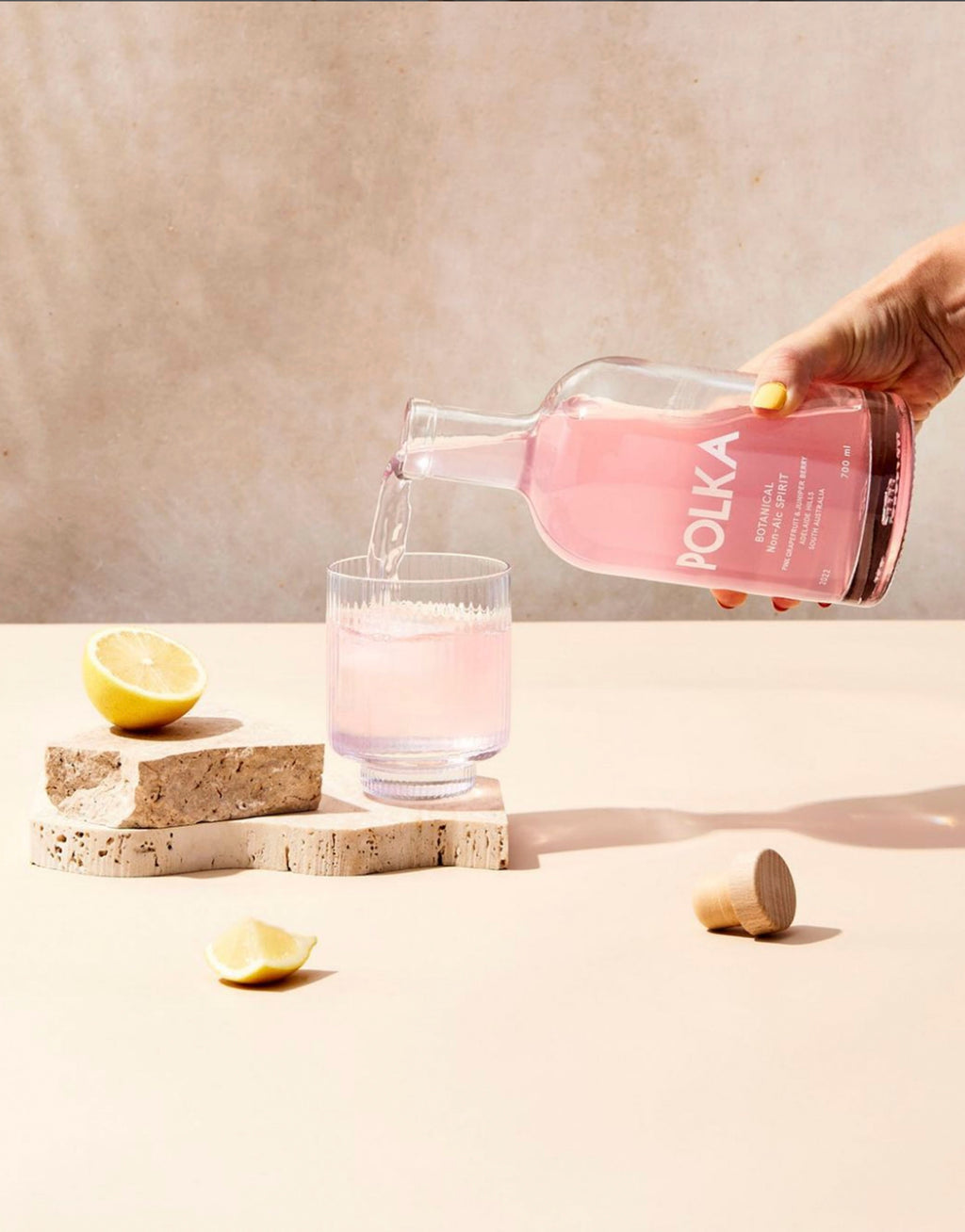Botanical spirit being poured into a glass